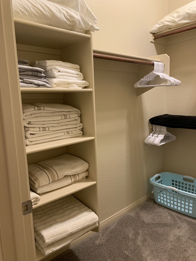 Master Bathroom walk in closet with all bedding - 19475 N Grayhawk Dr