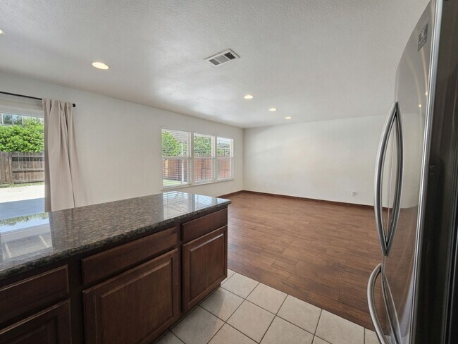 Building Photo - Spacious 4-Bedroom Home with Solar, Finished Garage, Large Pantry & Low-Maintenance Backyard in M...