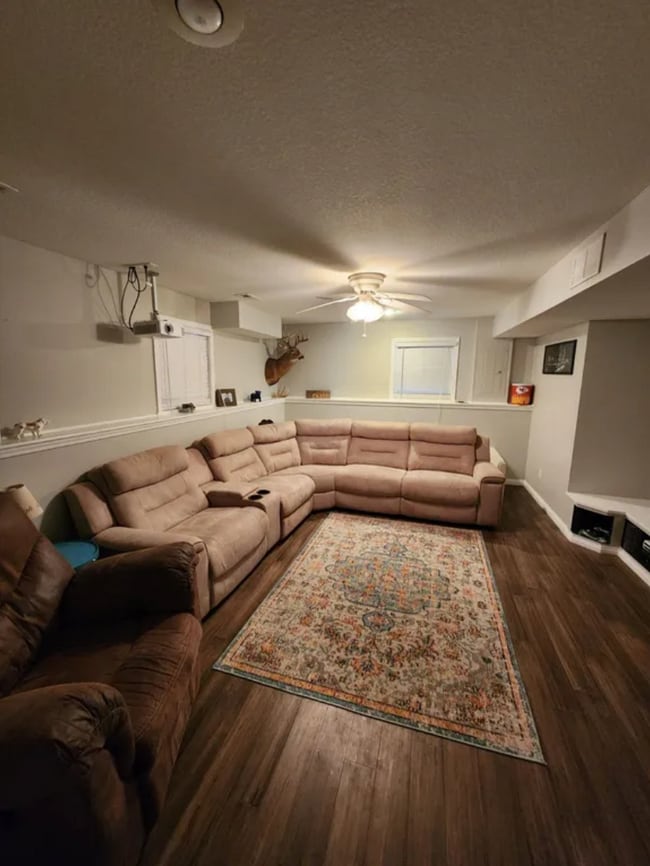 Downstairs rec room with 120 inch projector and built in console. - 411 Bayview Dr