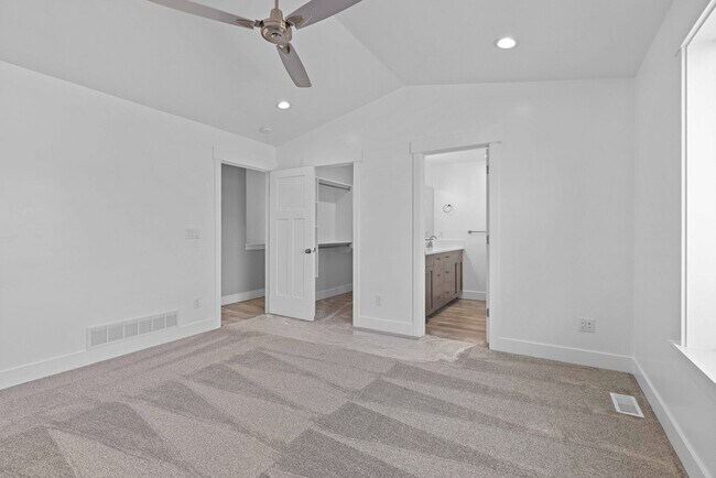 Building Photo - NEW HOME with large garage stalls and unfinished basement for additional storage