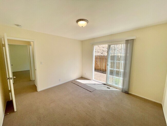 Building Photo - Sunlit 2BD/1BA w/ Private Balcony + Backyard! New Carpet! Assigned Parking! PROGRESSIVE
