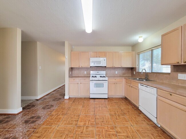 Building Photo - 3 bedroom one story home on large corner lot. Home has hard flooring throughout living areas and ...