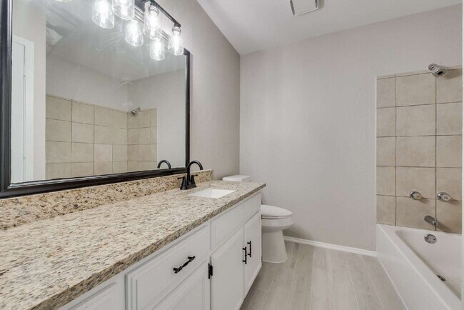 Building Photo - Completely Remodeled Triplex Unit 2 bed 1....