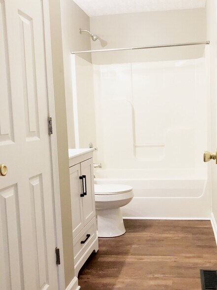 Bathroom with updated sink, lighting and toilet. - 216 Winters St