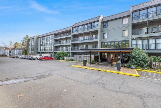 Building Photo - Sweet & Cozy 2/1 condo available in Mt. Park with covered parking, in-unit laundry, outdoor pool ...