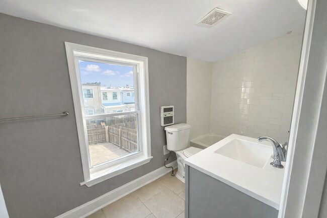 Building Photo - Charming Baltimore Rowhome with Private Backyard & Modern Updates