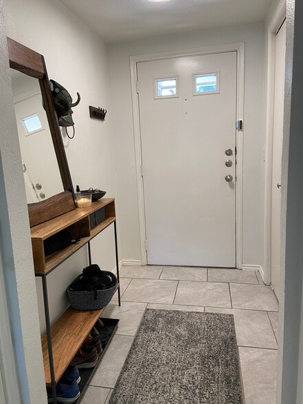 Entryway with Coat Closet, Under stair storage and Half-bath - 8604 Willowick Drive