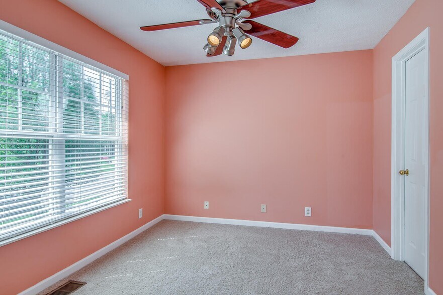 This guest bedroom has been updated with Agreeable Gray paint since this picture was taken. - 7109 Commonwealth Cir