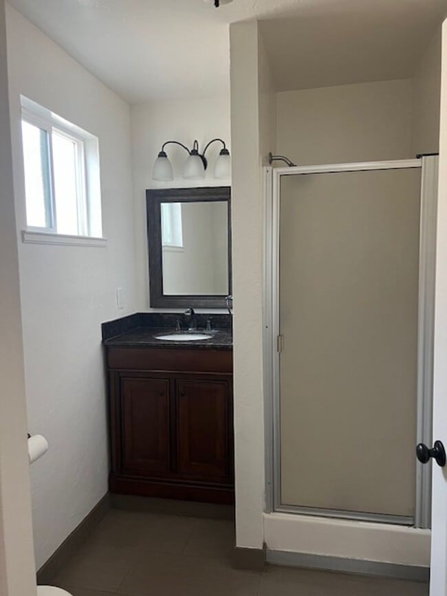 Building Photo - SEPARATE CHARMING COTTAGE / single family house, set off the street, in the back of the property.