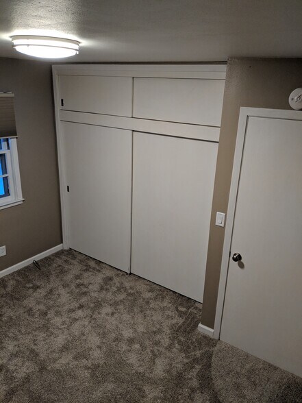 Bedroom Two Large closets and new carpet - 705 E. 19th Street