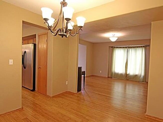 Building Photo - Great NE location -  4 bedroom 2.5 bath with attached 2 stall garage. Close to shopping & restaur...