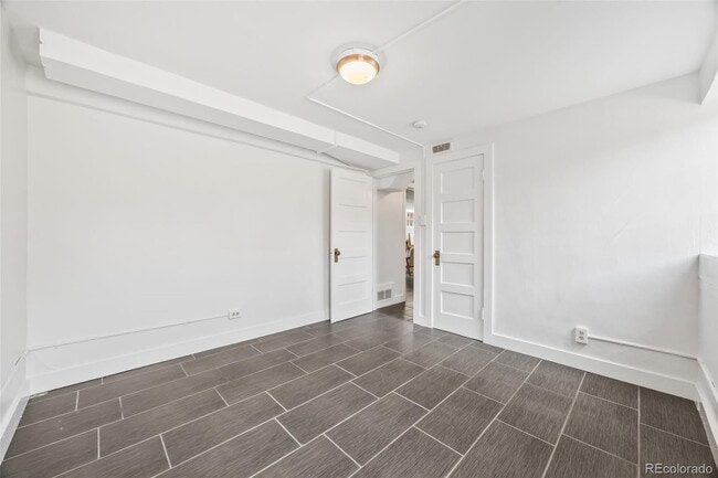 Building Photo - "Spacious 5-Bedroom Gem with Hardwood Floors & Cozy Fireplace in Denver's Heart!"