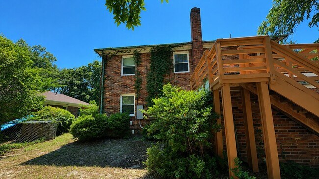 Building Photo - Charming 2BR with Sunroom, Hardwood Floors & Lawn Care Included