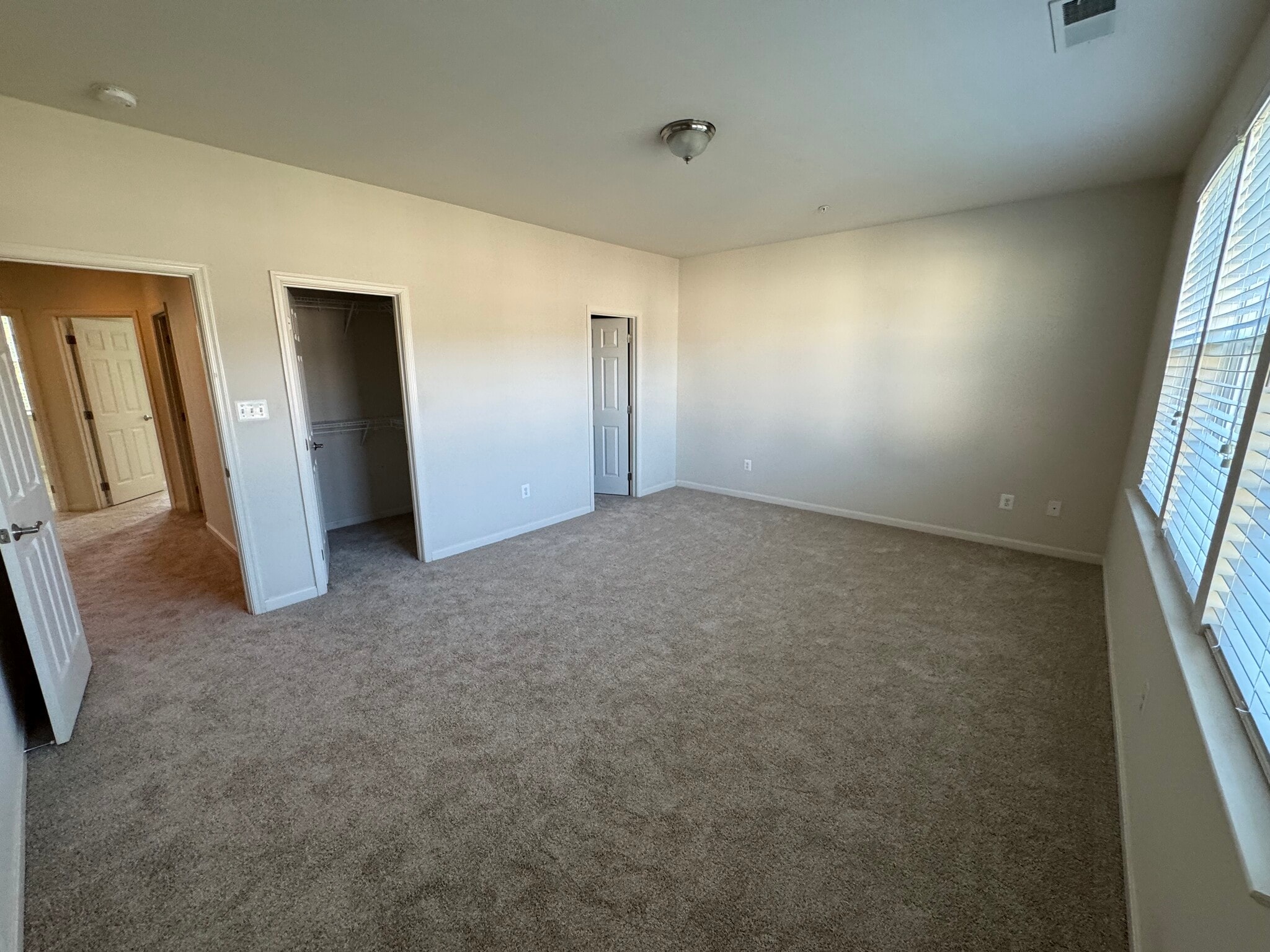 Here's a view of the TWO primary bedroom walk-in closets! - 44520 Gray Wolf St