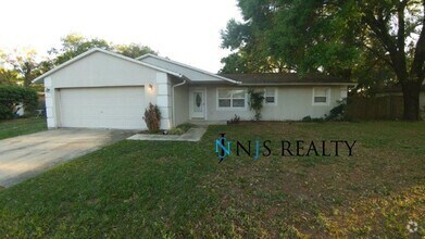 Building Photo - BEAUTIFUL 3/2/2 1400 Sq. Ft. with HUGE yar...