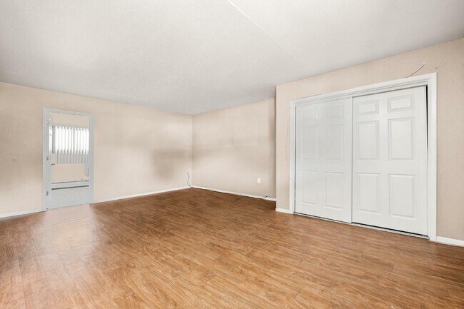 Experience the warmth of this spacious living room, perfect for relaxation and entertaining. - 1690 EATON