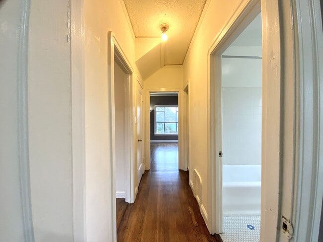 Building Photo - Spacious 1BR w/ Bonus Room! Laundry On Site! PRIVATE GARAGE PARKING!