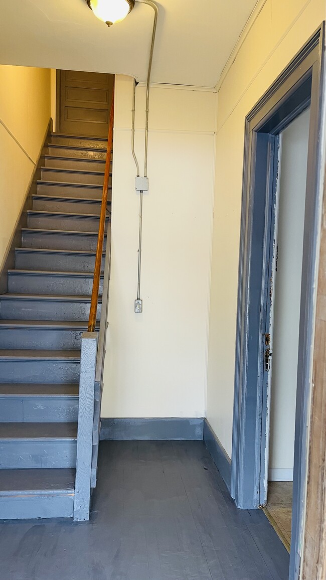 Door on right - entrance to apartment - 80 Main St