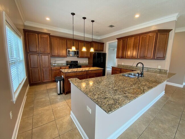 Building Photo - Family Home in Lafitte Landing – Fenced Ya...