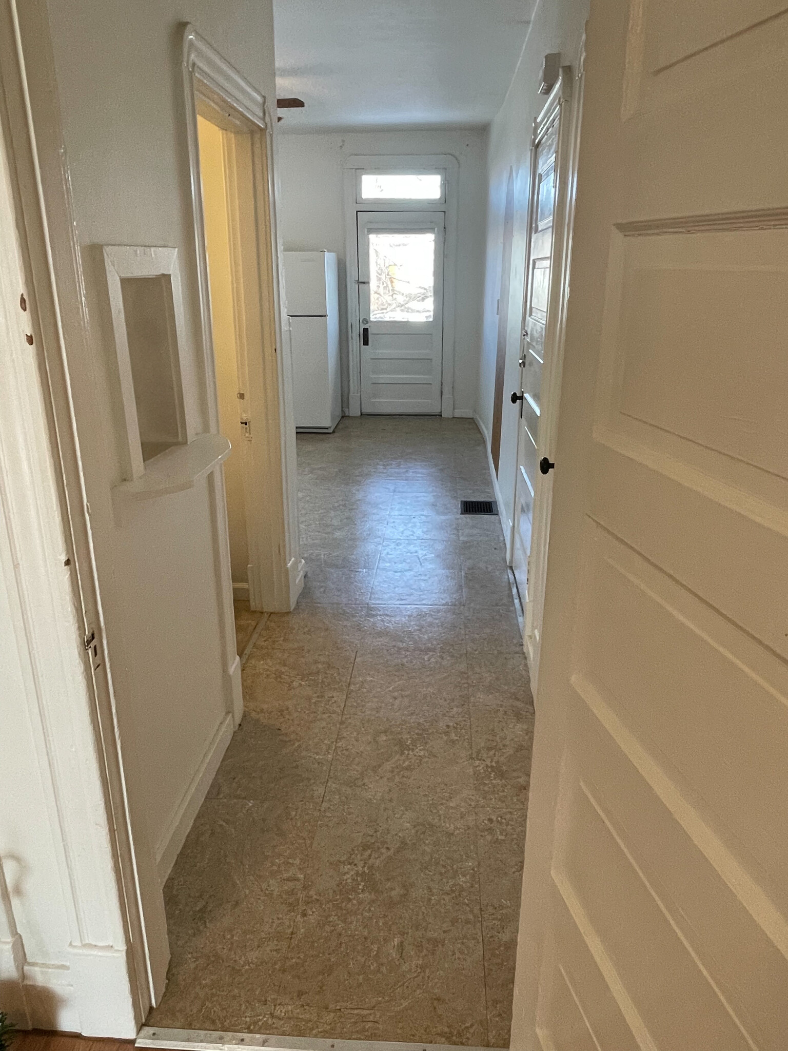 Featuring a telephone book & decorative painted archway in the kitchen. - 5313 Magnolia Ave