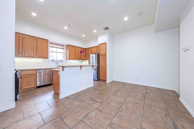 Building Photo - Stunning Upgraded Tri-Level Condo in South Coast Metro’s Exclusive Vantage Community