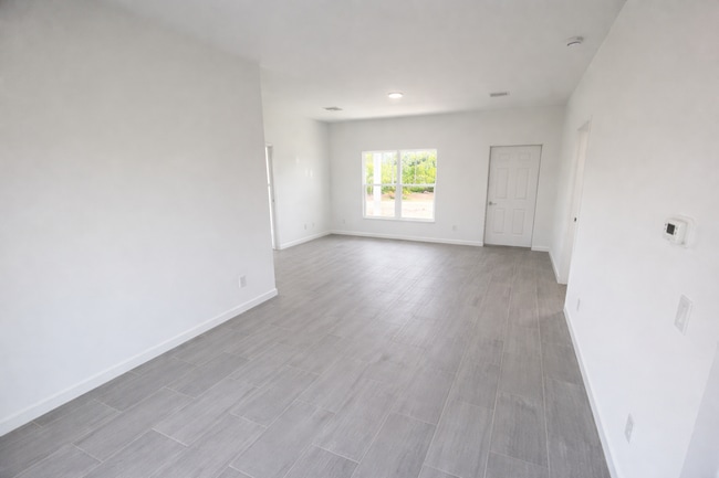 Building Photo - STUNNING NEW 3BR/2BA HOME WITH GARAGE -IN PRIME SW LEHIGH ACRES LOCATION