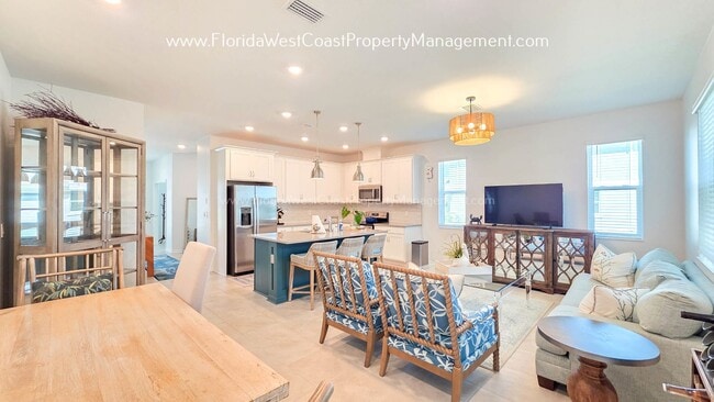 Building Photo - EXCEPTIONAL AND SPACIOUS FURNISHED TOWNHOME WITHIN WATERSIDE- NAUTIQUE!
