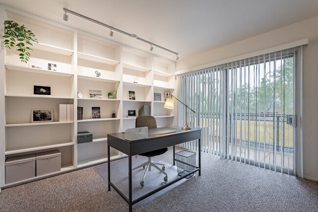 Home office with built-in bookcases - 3940 E. Timrod St. #226