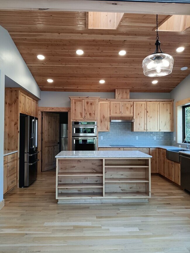 Building Photo - Beautiful Chalet Style Riverfront Property...