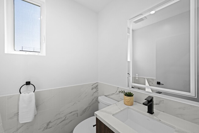 Building Photo - Stunning brand-new 3 Bedroom 4 Bathroom townhouse with private garage and rooftop balcony!