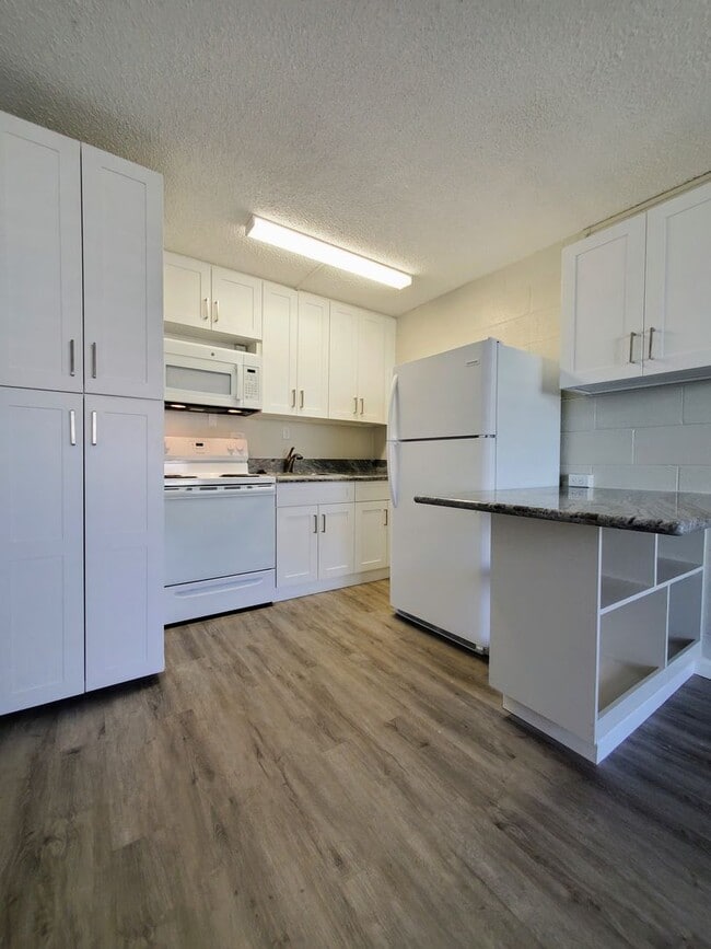 Building Photo - Available Now | Unfurnished 1 Bedroom, 1 Bath 2nd Floor Walk-up with 1 Assigned Parking Stall