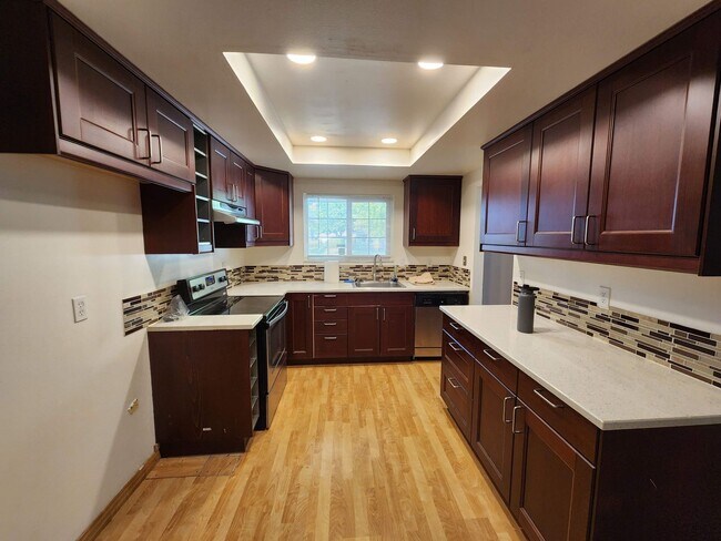 Building Photo - Adorable 4/2 With GREAT Backyard.  Gardene...