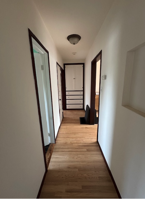 Hallway between bedrooms (bathroom on the left). - 657 Euclid Ave