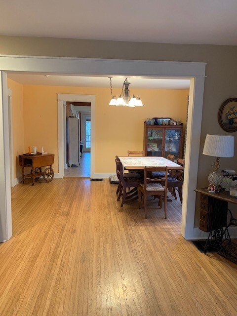 Looking from the front door through the living and dining rooms. Kitchen straight back. - 704 W Cherokee Dr