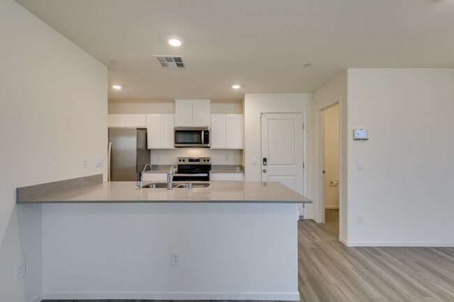 Building Photo - Gorgeous Townhome with upgrades in gated community* 3 large bedrooms, 2 car garage*Community pool...