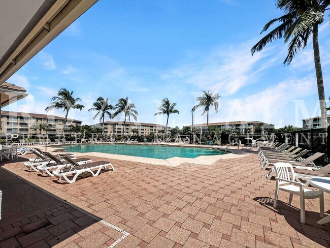 Building Photo - Estero 2BR Condo – $500 Off When You Wrap Up a New Lease This December (Go Ahead, Take It to the ...