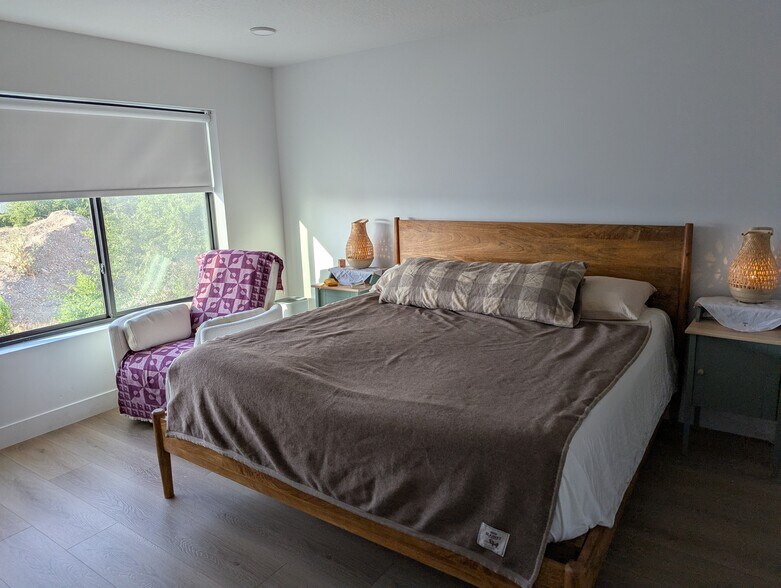 master bedroom with ensuite bathroom wood finished floors and recessed lighting - 44 W Iko Ave
