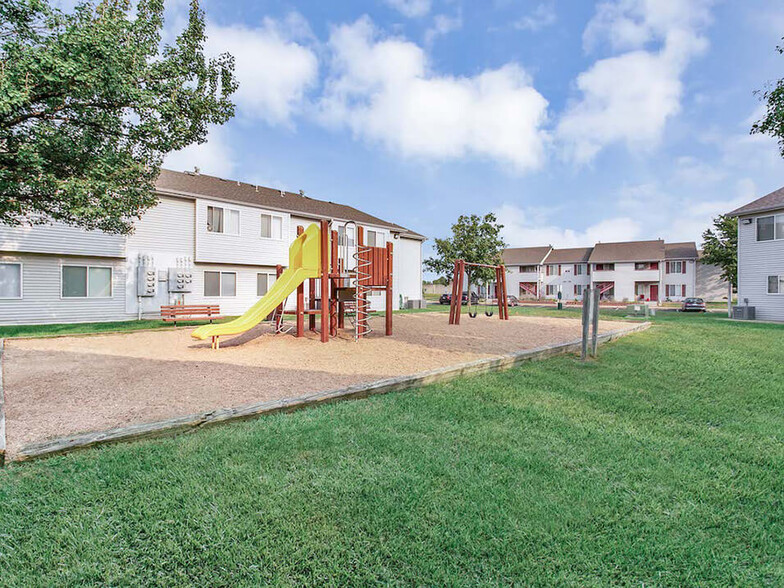 Playground with Grassy Area - Northridge Crossing Apartments and Townhomes