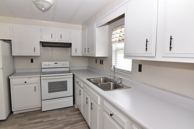 Primary Photo - Spacious & Updated Double-Wide Home on a L...