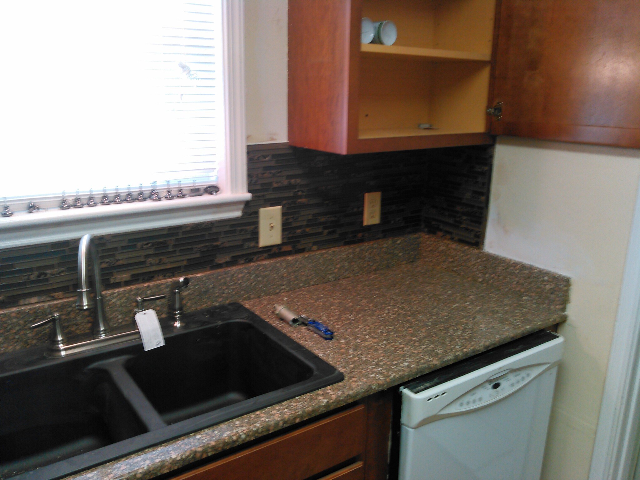 Kitchen- Updated back splash, cabinets and counter tops - 7933 Bles Ave