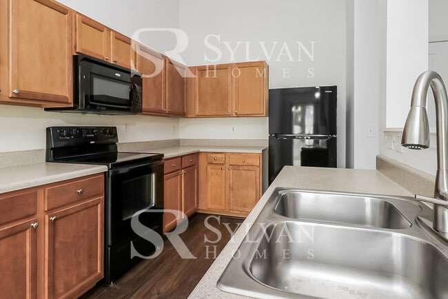 Building Photo - This adorable home is ready for your personal touch!