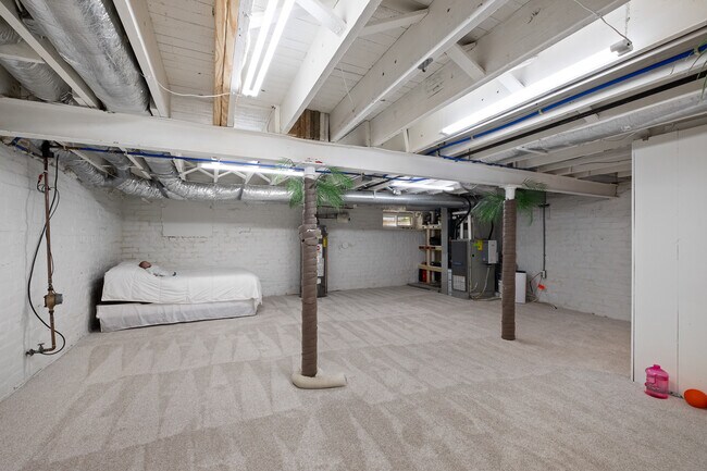 Basement with carpeting and full perimeter sump pump.. - 31 Dartford Ave