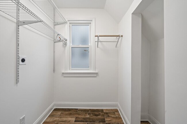 Full size laundry room located upstairs with plenty of shelves and storage space - 4517 Tracy Ave