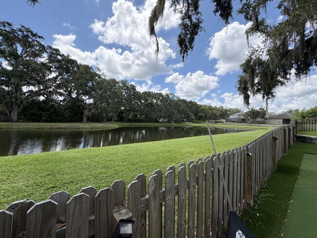 Building Photo - Spacious 5-Bedroom Pool Home with Putting ...