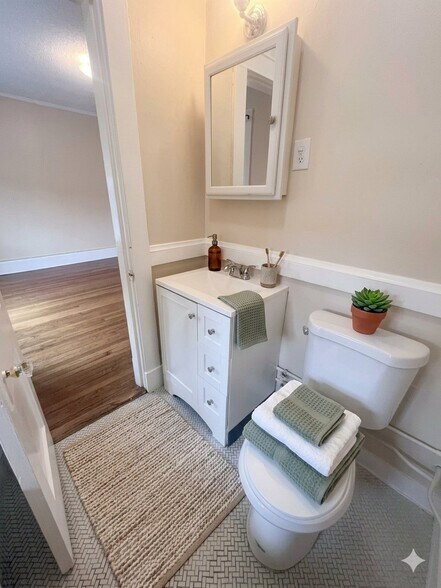 The bathroom is right off the living room - 144 Van Zandt Ave