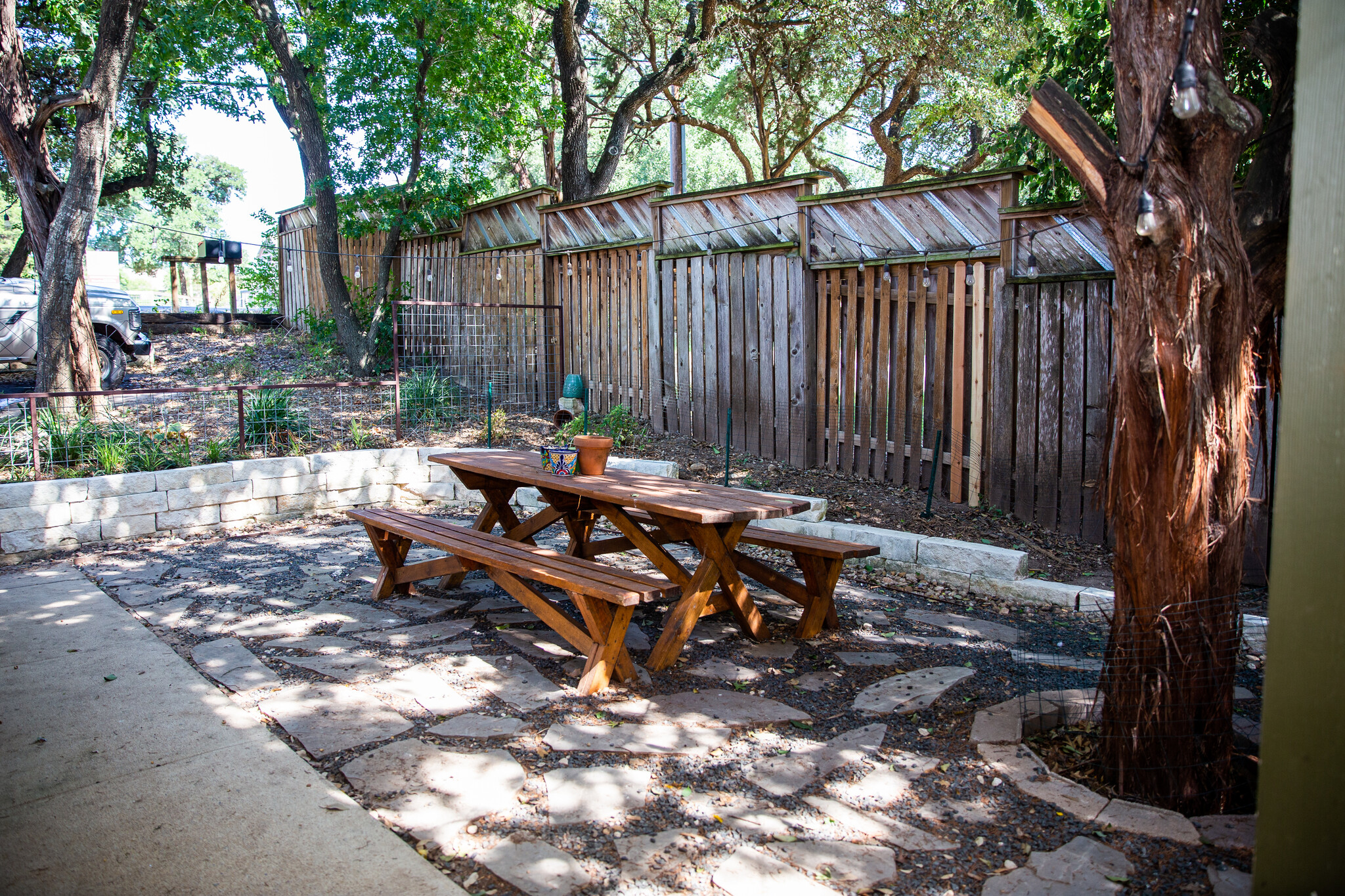 Shaded patio and yard, fenced in. - 3607 Clawson Rd