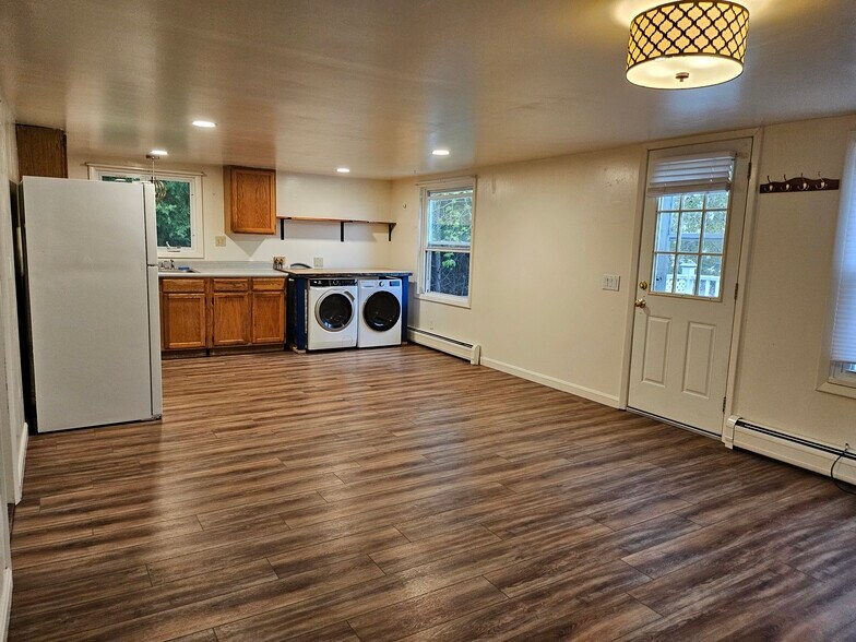 Enter into open layout kitchen that is open to living room. Lots of space to furnish both! - 132 Hinesburg Rd