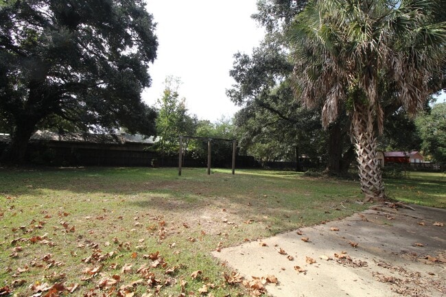 Building Photo - Spacious 3BR/1.5BA Home in Pace with Open Living Area, Tiled Family Room, and Fenced Backyard – M...