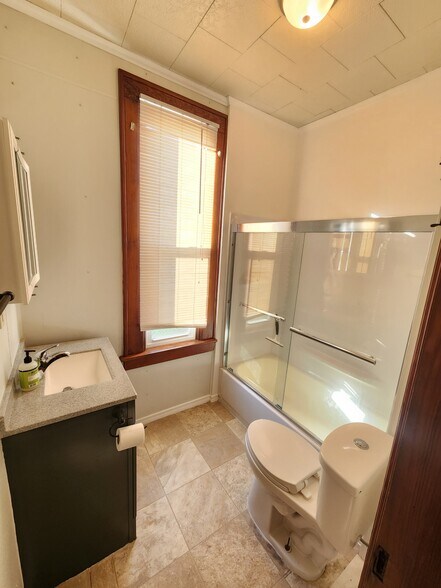 Full Bath with Sliding Glass Shower Doors - 2548 Jackson St