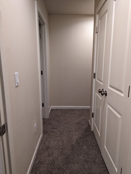 Hallway from back bedroom (3rd bedroom). - 713 E Main St